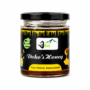 Dokos Honey in a premium glass jar with black lid, displayed on a clean white background to highlight the rich amber color and original Dokos branding.