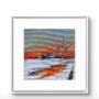 Framed winter landscape painting featuring a glowing orange sunset reflected across a snowy riverside scene.