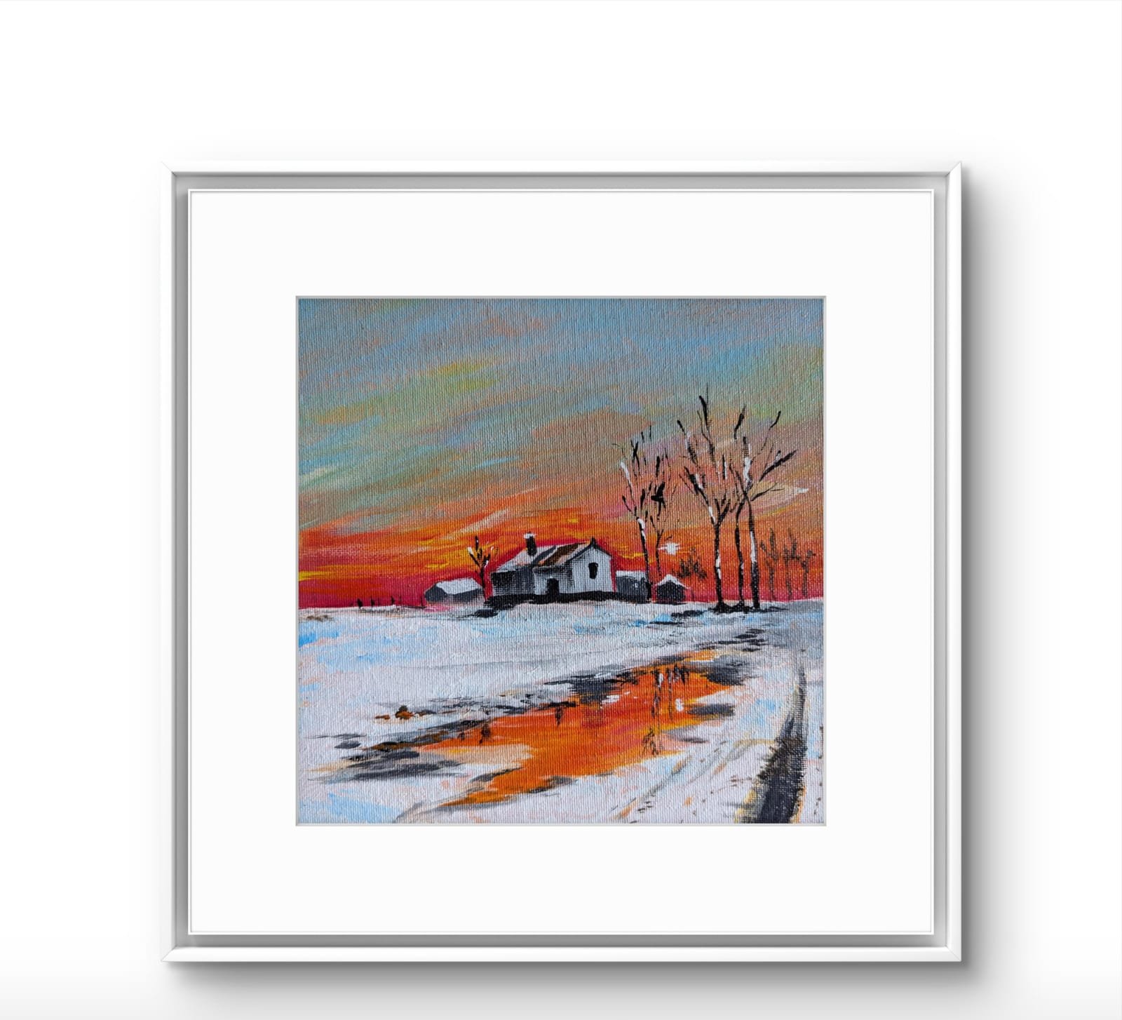 Framed winter landscape painting featuring a glowing orange sunset reflected across a snowy riverside scene.