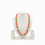 Traditional Gurung Piru Mala necklace with coral red, green beads, and gold accent spheres displayed on a white jewelry mannequin stand.