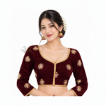 Woman wearing a burgundy red Nepali Chaubandi Cholo blouse with gold embroidery